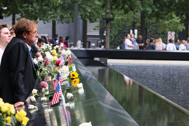 Families of the victims of the 9/11 terror attack look out on the Memorial Pool during the annual 9/11 Commemoration Ceremony at the National 9/11 Memorial and Museum on September 11th, 2022.